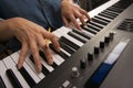 Woman's Fingers on Digital Piano Keys