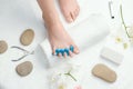 Woman`s foot with toe separator