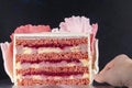 Cake Red velvet in cross section with pink and white mastic decorations on dark background Royalty Free Stock Photo