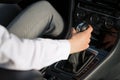 Woman`s hand on the automatic transmission`s close-up