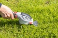 Garden hand tool for cutting short grass in the garden near the fences. Royalty Free Stock Photo