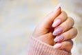 A woman's hand with beautiful pink gel nails. Well-groomed and perfectly painted. Royalty Free Stock Photo