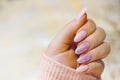 A woman's hand with beautiful pink gel nails. Royalty Free Stock Photo