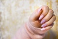 A woman's hand with beautiful pink gel nails. Royalty Free Stock Photo