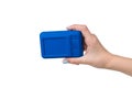 A woman`s hand with a blue camera isolated on a white background