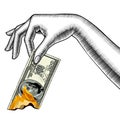 Woman`s hand with burning a 100 dollar banknote Royalty Free Stock Photo