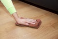 Woman`s hand cleaning the floor with a floorcloth