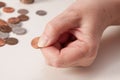 Woman's hand close up pinching a penny