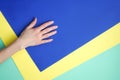 Woman`s hand on colorful background