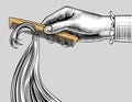 Woman`s hand combing hair with a retro comb