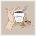 Woman\'s hand with a cup of coffee, chocolate chip cookies, checkered napkin Royalty Free Stock Photo