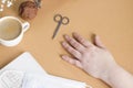 Woman`s hand with dirty unkempt nails requiring a manicure during coronavirus blockage