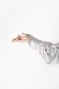 woman's hand in elegant silk clothes. elegant palm faced upwards with space for your product