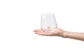 A woman`s hand with an empty glass glass isolated on a white background Royalty Free Stock Photo