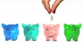 Woman's hand giving giving a coin to a piggy bank
