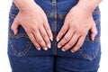 Woman's hand holding the backside : Concept hemorrhoids Royalty Free Stock Photo