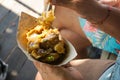 Woman's hand holding Balinese food.