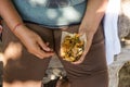 woman's hand holding Balinese food.