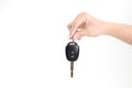 A woman`s hand holding a car key on an isolated background Royalty Free Stock Photo