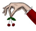 Woman`s hand holding cherries in her fingers Royalty Free Stock Photo