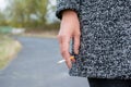 Woman`s hand holding a cigarette Royalty Free Stock Photo