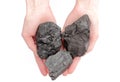 Woman's hand holding coal lumps on white background Royalty Free Stock Photo