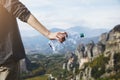 Woman`s hand holding empty used plastic water bottle, waste management Royalty Free Stock Photo