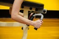 Woman's hand holding exercise bench in gym.Strength and motivation