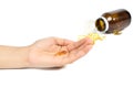 Woman`s hand holding Fish oil capsules with omega 3 and vitamin D healthy diet concept Royalty Free Stock Photo