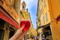 Woman s hand with a glass of raspberry Lambic ale at a restaurant in Nice France