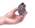 Woman`s hand holding high altitude Smokey quartz Gwindel quartz