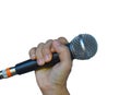 Female hand with microphone on white background Royalty Free Stock Photo