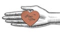 Woman`s hand holding on the palm a red paper heart with I love Y