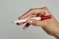 A woman`s hand with red pen. Royalty Free Stock Photo