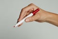 A woman`s hand with red pen. Royalty Free Stock Photo