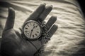 A woman`s hand holding a watch Royalty Free Stock Photo