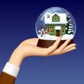 Woman`s hand holding a Xmas snow globe with snowman, green woode