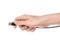 A woman's hand holds a cable with a usb connector. The concept of connecting a computer device Royalty Free Stock Photo