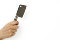 Woman`s hand holds cleaver on white background close-up, isolated Royalty Free Stock Photo