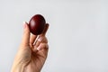 woman's hand holds an Easter colored egg isolated on a white background. Royalty Free Stock Photo