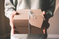 Woman`s hand holds gift boxes to loved ones on important days such as Christmas, New Year, birthdays