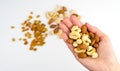 Woman`s hand holds a mix of nuts. Healthy food. Close-up. Top view Royalty Free Stock Photo