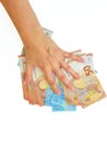 The woman`s hand holds the paper money of the euro against a white background. Royalty Free Stock Photo