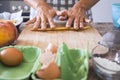 Woman`s hand at home preparing a pizza or a cake in ancient way like grandmother do - handmande and homemade cake and cook and Royalty Free Stock Photo