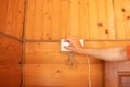 A woman& x27;s hand inserts a charger into a socket on the wall, inserting a plug into a socket Royalty Free Stock Photo