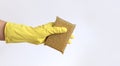 A woman's hand in a latex glove holds a sponge-scraper for washing Teflon surfaces Royalty Free Stock Photo