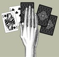 Woman`s hand laying out playing cards fan. Vintage engraving sty Royalty Free Stock Photo