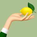 Woman`s hand with a lemon isolated on green background