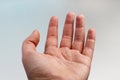 Woman`s hand on a light background. Open palm