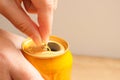 A woman's hand opening an aluminum yellow beer or soda. Extreme close-up of woman opening canned drink Royalty Free Stock Photo